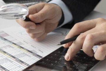 business-man-calculating-finance-numbers